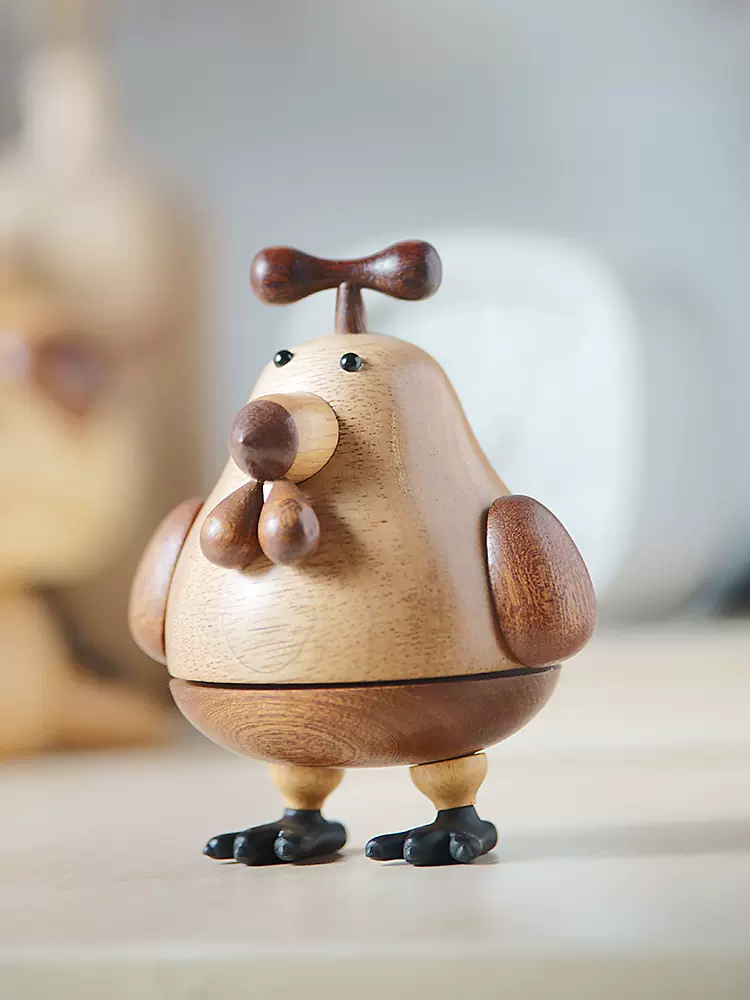 A charming wooden music box featuring a chicken design