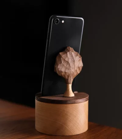 Wooden phone stand box with an apple tree carving design