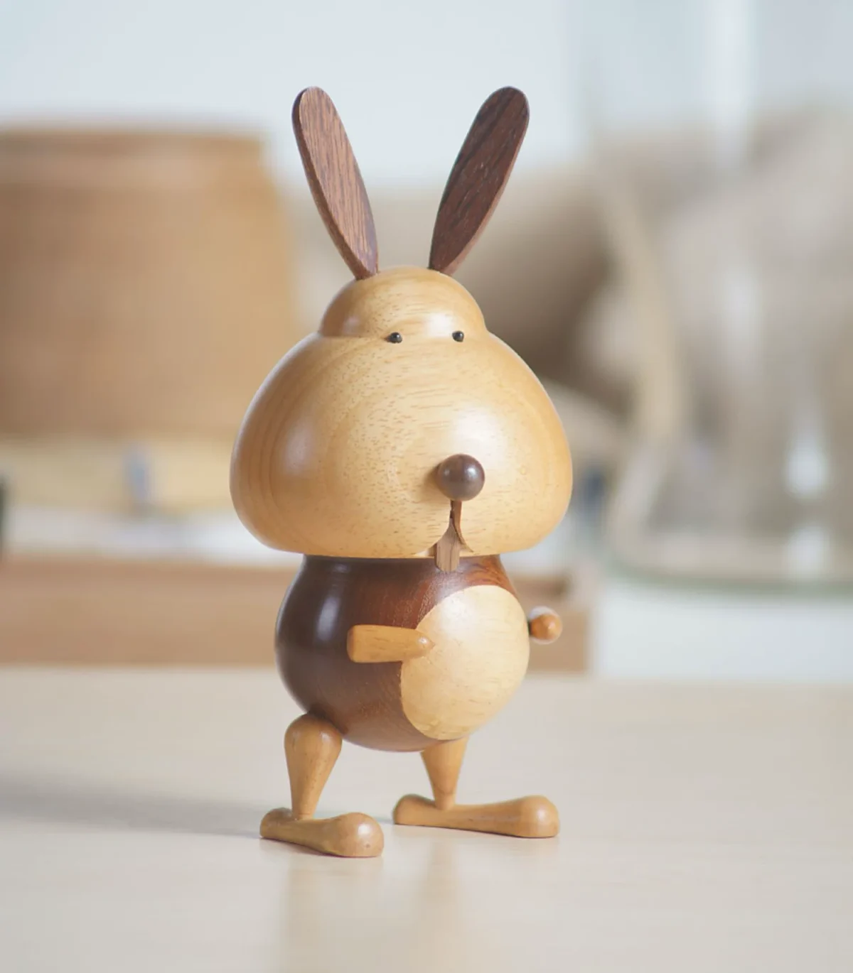 A charming wooden music box featuring a general rabbit design, perfect for kids