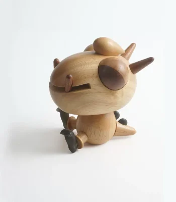 A cute crafted wooden music box featuring a dragon design