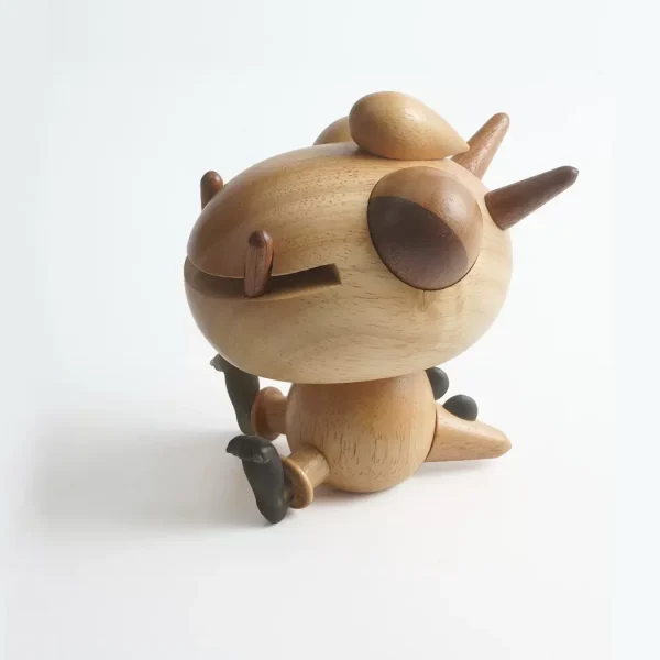 A cute crafted wooden music box featuring a dragon design