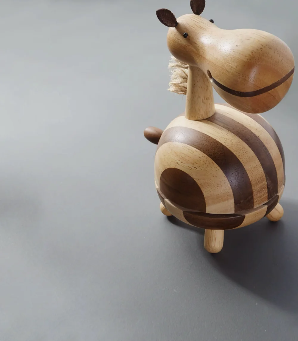 Closeup view of a beautifully crafted wooden horse music box