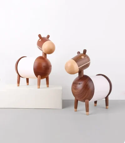 A charming wooden tissue holder featuring two donkey designs