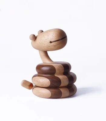 A unique wooden snake music box, perfect for adding a whimsical touch to your decor