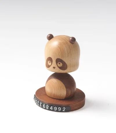 Add whimsical charm to your car with this Shaking Head Panda wooden phone number plate, combining fun and functionality