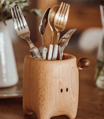 This mushroom-shaped wooden storage box offers a charming and functional solution for organizing small items, making it a delightful addition to any room