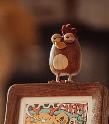 A charming handcrafted chicken-themed ornament designed