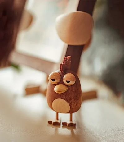 A charming handcrafted chicken-themed ornament designed