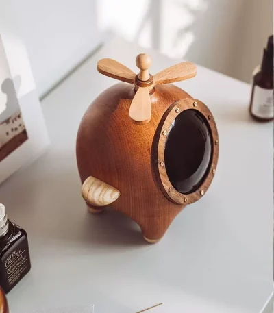 A unique wooden helicopter jewelry box, perfect for storing your treasures while adding a touch of playful elegance to your decor