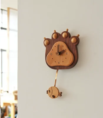 A charming bear paw pendulum wall clock, perfect for adding a whimsical touch to your home