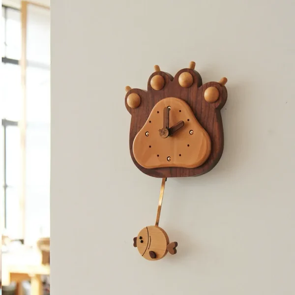 A charming bear paw pendulum wall clock, perfect for adding a whimsical touch to your home