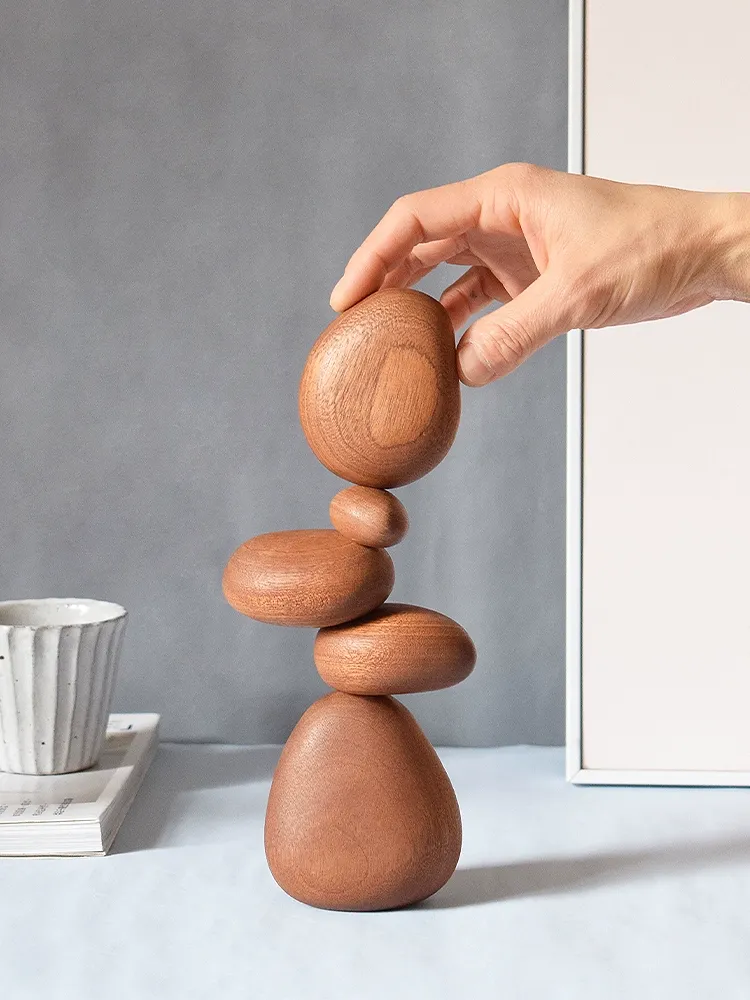 Handcrafted wooden stones for balancing, designed to enhance relaxation and mindfulness