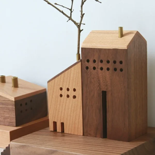 Charming handmade miniature wooden house with flower arrangement for creative home decor