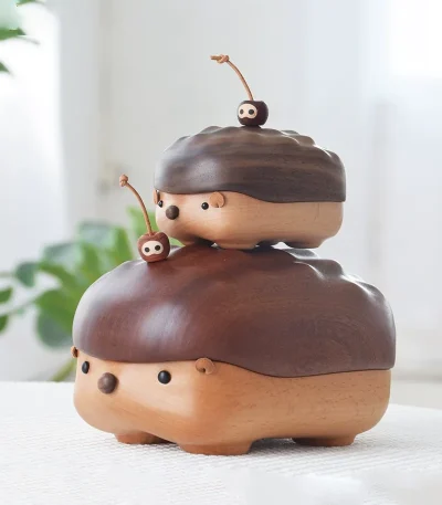 Two hedgehog-shaped wooden storage boxes in different sizes, showcasing walnut and ebony wood options