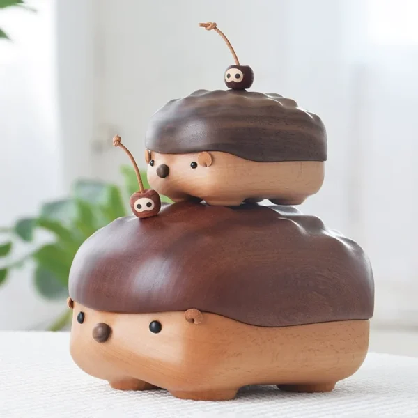 Two hedgehog-shaped wooden storage boxes in different sizes, showcasing walnut and ebony wood options