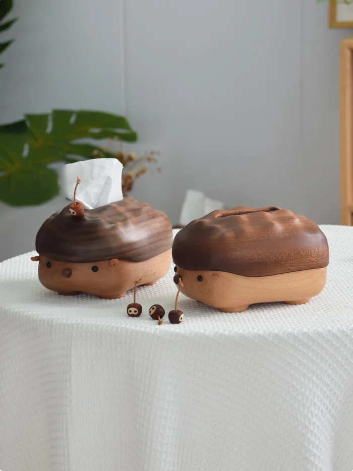 Two hedgehog-shaped wooden storage boxes in different sizes, showcasing walnut and ebony wood options