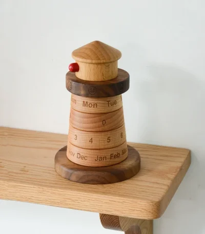 Add a unique maritime flair to your workspace with this lighthouse wooden perpetual calendar, ideal for any desktop setup