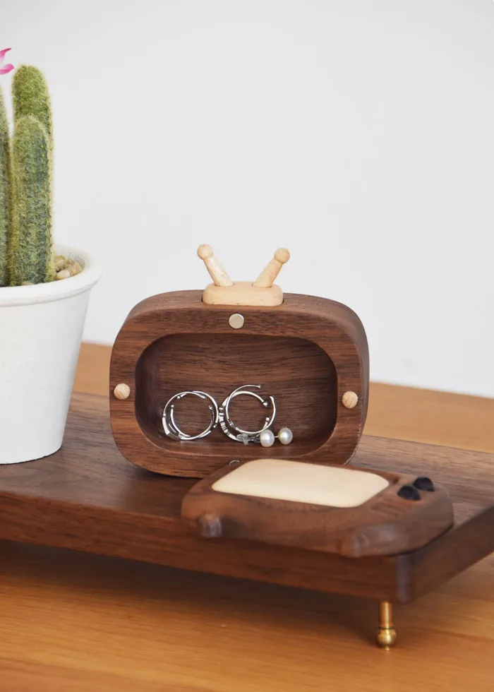 A functional and adorable mini TV-shaped storage box, ideal for storing small items like toothpicks or pills