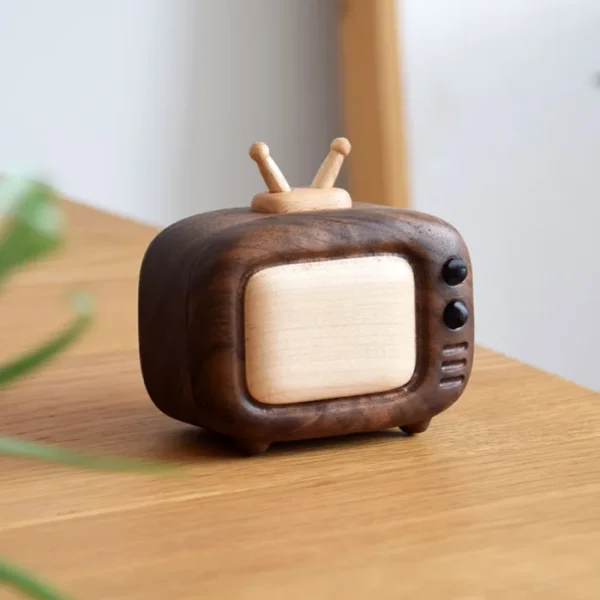 A handcrafted walnut wood mini TV-shaped toothpick holder, perfect as a stylish decor piece for your table