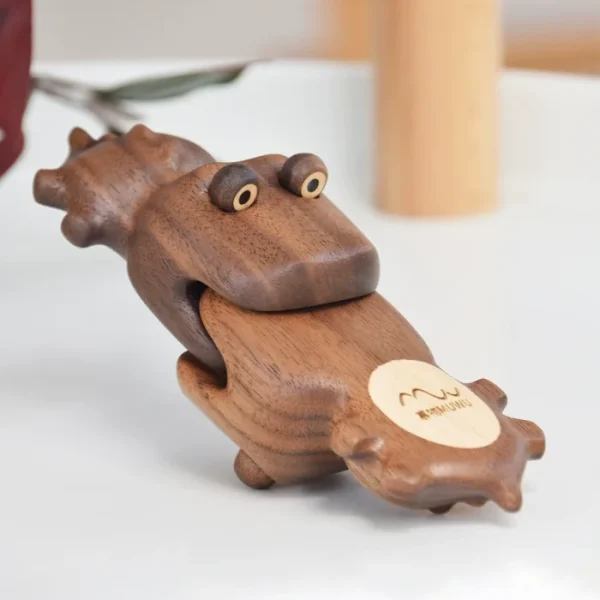 A creatively designed crocodile-shaped fridge magnet crafted from solid walnut wood with hidden magnets, perfect for home decor