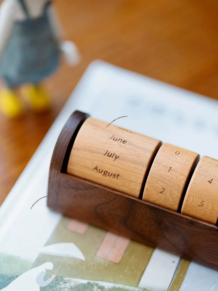 A nature-inspired wooden desk calendar featuring tree rings, ideal for those who appreciate minimalist and rustic decor.