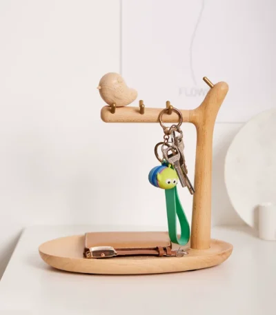 A wooden tit-shaped key holder with a storage tray, perfect for tabletops