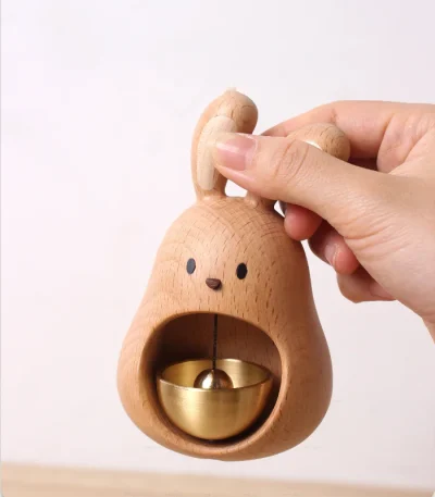 Wooden doorbell featuring a big mouth rabbit design