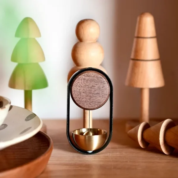 A magnetic wood and brass doorbell that brings elegance to your home décor