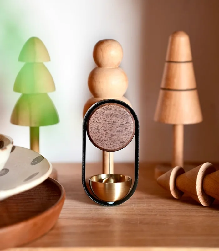 A magnetic wood and brass doorbell that brings elegance to your home décor