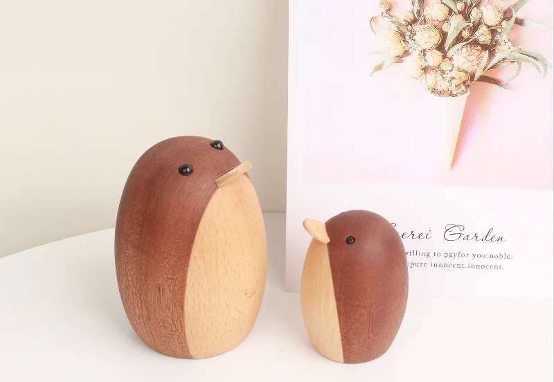 Set of handcrafted wooden penguin figurines, perfect for adding a cute touch to your living space