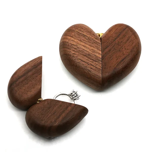 Elegant wooden ring box in a heart shape, perfect for proposals