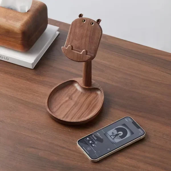 A walnut wood phone stand with a built-in storage plate, ideal for home decor