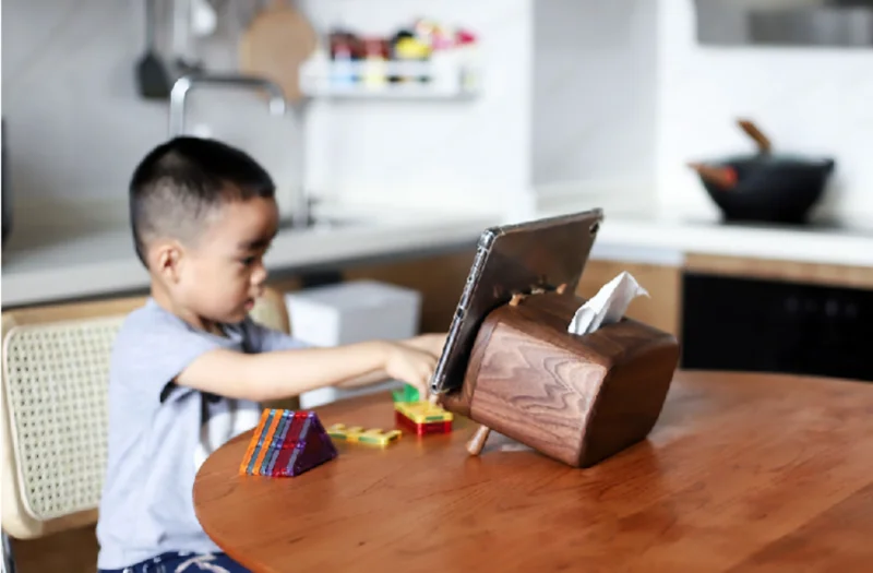 Wooden tissue dispenser with a stand for phones, perfect for home