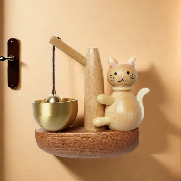 Wooden doorbell with a playful cat design