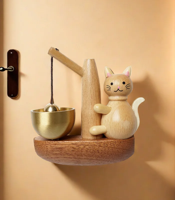 Wooden doorbell with a playful cat design