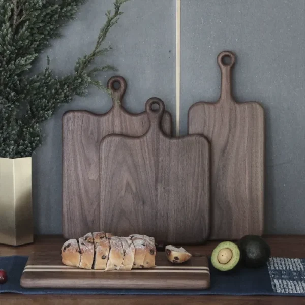 Rustic wooden cutting board with handle for bread and cheese