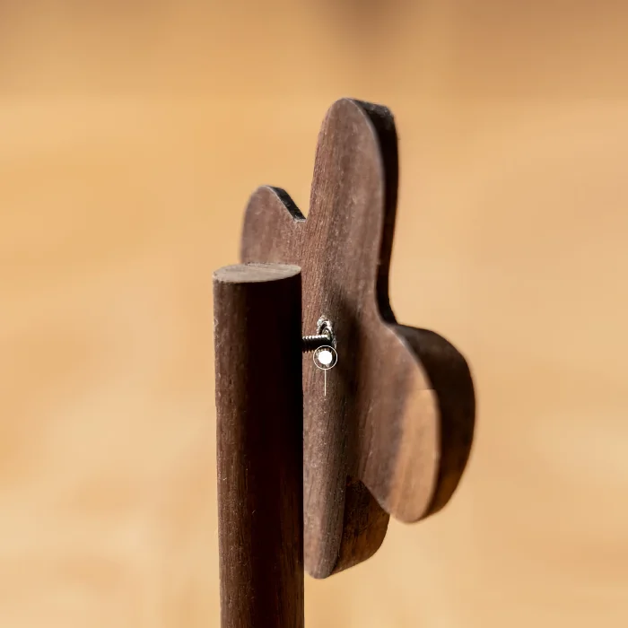 A detailed view of a small wooden pinwheel decor piece