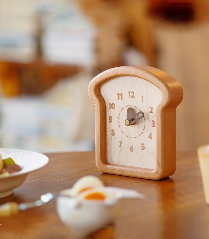 Toast-shaped wooden clock made from cherry and walnut wood, ideal for wall or table decor