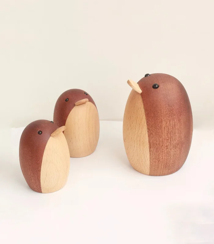 Adorable wooden penguin decor piece for desk, designed to bring a touch of calm