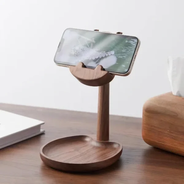 Hippo-shaped wooden phone stand with a tray for organizing small items