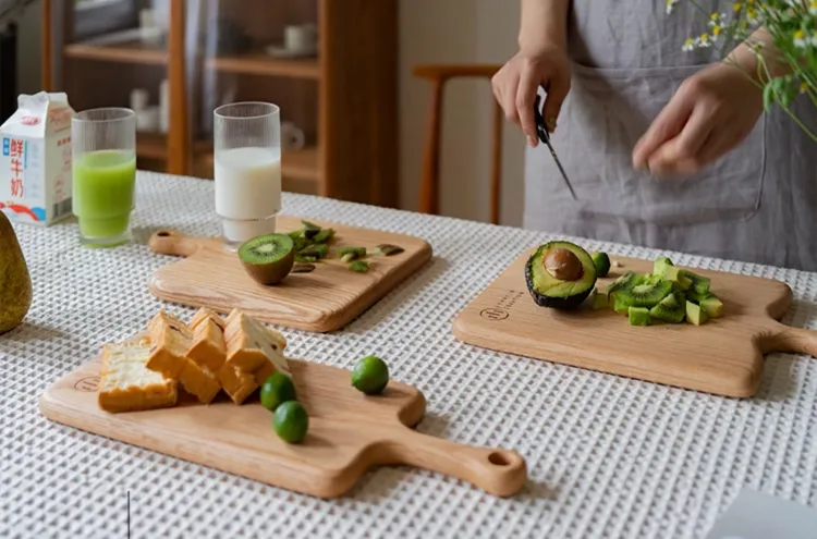 Wooden kitchen cutting board with handle for small plates