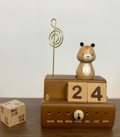 A squirrel-themed music box with a wooden block calendar for daily use