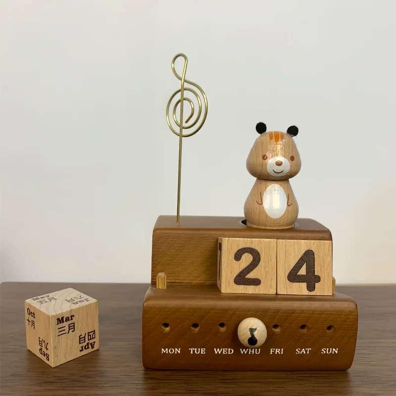 A squirrel-themed music box with a wooden block calendar for daily use