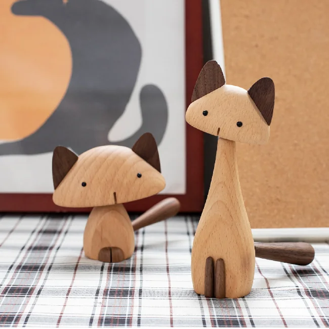 A set of wooden tall and short cat figurines, perfect for decor