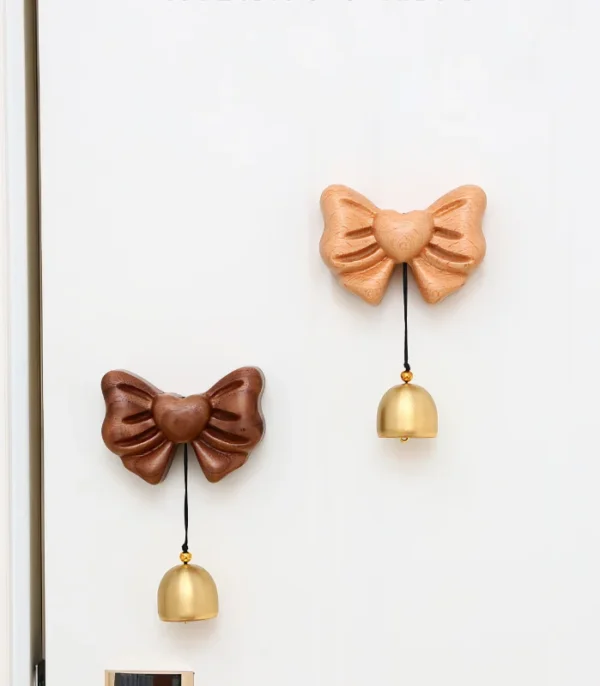 Elegant wooden doorbell with a bow knot design, perfect for adding a soft