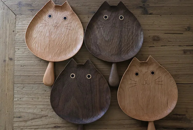 Artisan wooden plates featuring an adorable cat design