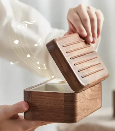 Compact wooden ring box with a secure lid and music function, perfect for small jewelry storage