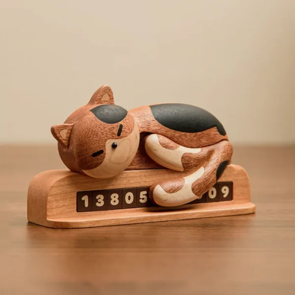 Adorable wooden parking plate featuring a sleeping cat design