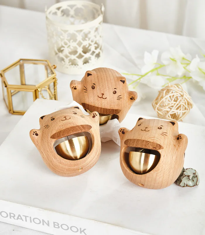 A unique wooden doorbell with a smiling cat, bringing a joyful and friendly vibe to your front door