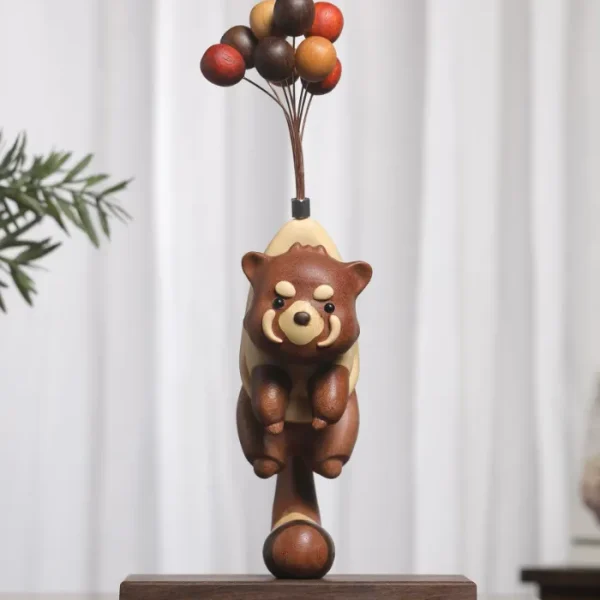 Handcrafted wooden raccoon figurine with a whimsical flying pose, perfect for your home decor